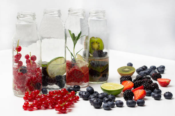 istock Red currants, strawberries, blueberries and blackberries on table. 1565472039