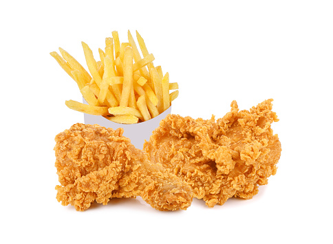 Fried chicken and french fries in a white paper box isolated on white background