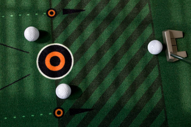 istock Indoor golf putting on green practice mat 1565484377