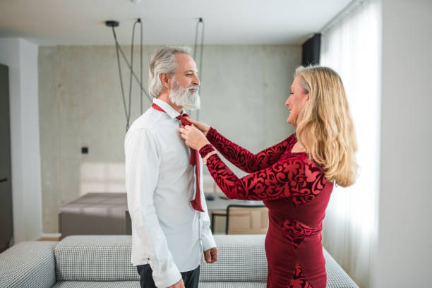 istock Mature Couple Dressing Up For Gala Event 1565502036