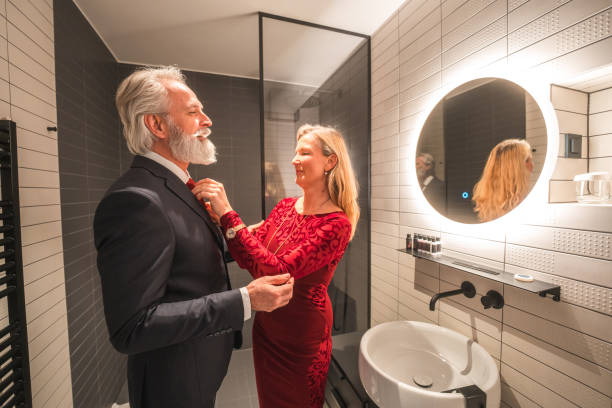 istock Senior Caucasian Male Dressing Up With Wife's Help 1565502569