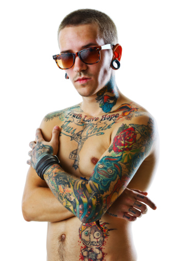 Young male with tattoos. Studio shot.