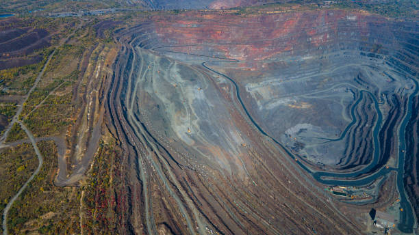 istock Huge iron ore quarry iron ore quarry top view Aero photo shoot. 1565520410