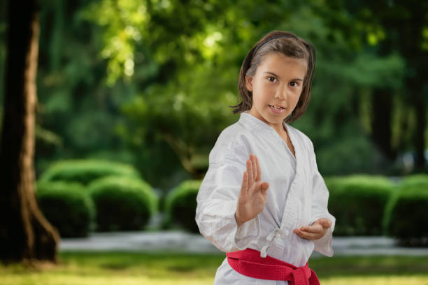 istock Karate boy showcases skills in the park 1565521904