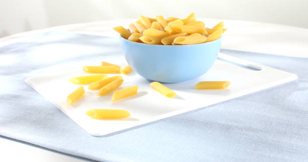 Raw Italian pasta penne. traditional italian food close up.