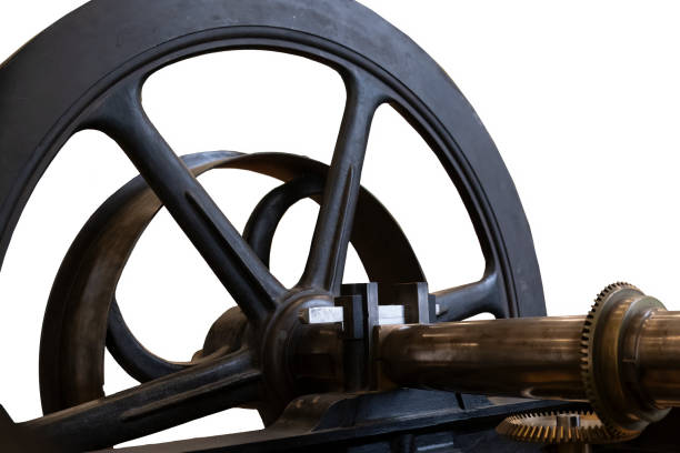Close up of vintage antique gear assembly and wheel, isolated on white with a clipping path. Steampunk feel. High quality photo