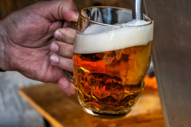 Hand tapping beer, closeup. stock photo