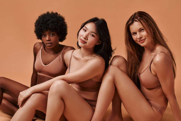 istock Multiethnic women on beige background 1565610499