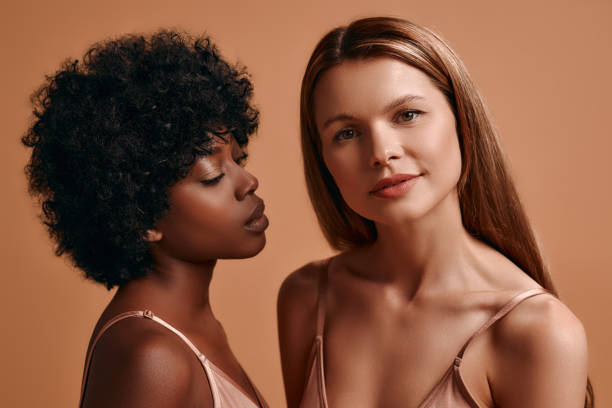 istock Multiethnic women on beige background 1565611059