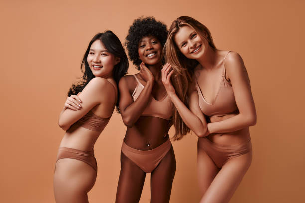 istock Multiethnic women on beige background 1565612872