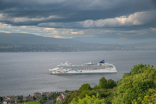 Oslo, Norway, July 6, 2023 - Sky Princess cruise ship in Oslo harbor, Akershus fortress in the background.