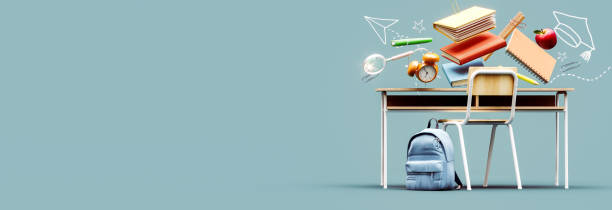 istock School desk with bag and school accessories on blue background with copy space. 1565620149