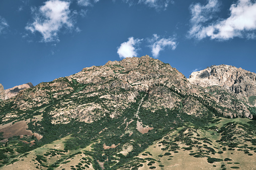 Clouds above mountain peaks. Tien Shan mountains