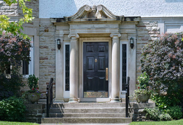 istock Elegant front door with classical style stone columns 1565639299