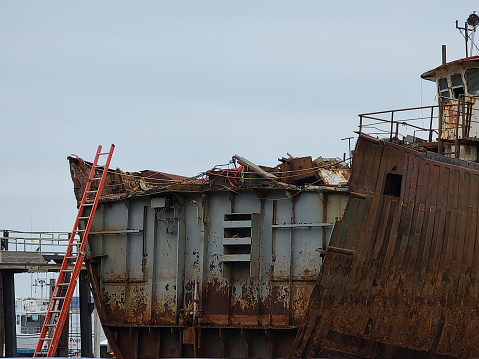 Closeup of Wreck of the Peter Iredale on sand beach on foggy day, Fort Steven's State Park, Oregon, USA