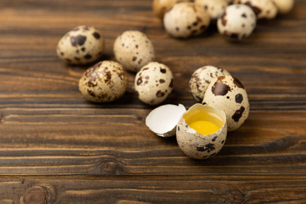 istock Quail eggs on a  texture background.Organic food. Place for text. Fresh quail eggs. 1565681094