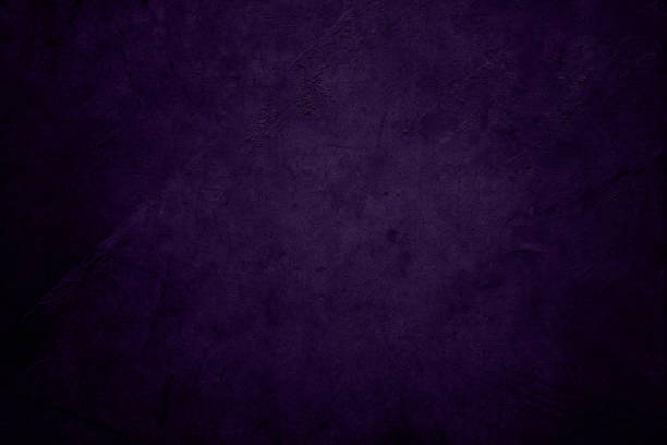 istock Dark purple textured concrete background 1565682730