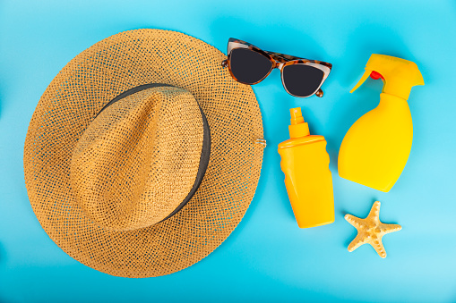 Sunscreen on a blue background. SPF cream. Sun protection. UV protection. Summer. The concept of rest and vacation. Summer mood. Design. MOCKUP. Vacation.Beauty