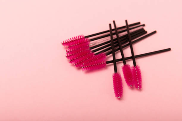 istock Brushes for eyelash extension on a background. Brush for combing eyelashes.brush for straightening eyelashes and eyebrows. 1565693372