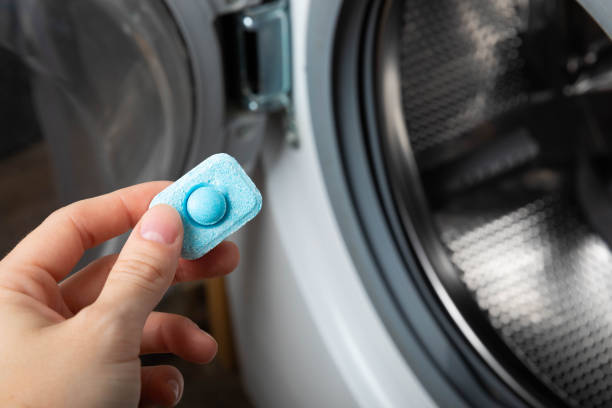 istock Water softener tablets on a colored background, flat lay. Space for text.Capsules for washing machines and dishwashers that prevent limescale. Place to copy. 1565706632