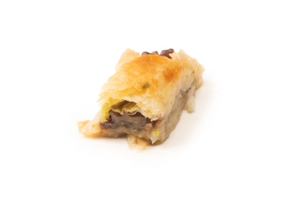 istock Delicious sweet baklava with walnuts isolated on white background. 1565724236