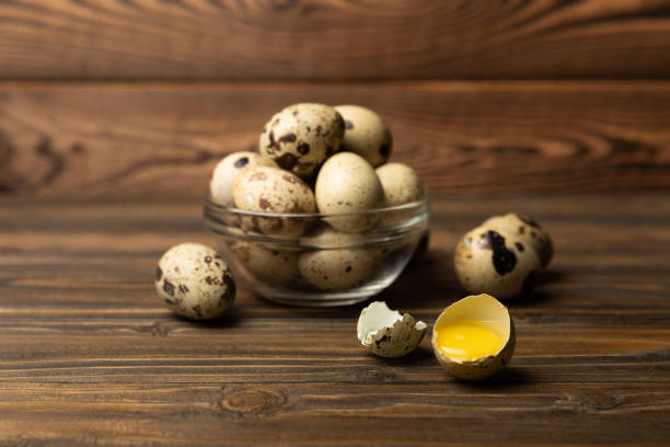 Quail eggs on a  texture background.Organic food. Place for text. Fresh quail eggs.