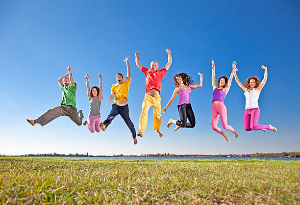 istock Happy smiling  group of jumping  people 156574273