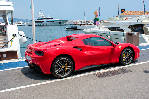 Maranello, Italy - May 30, 2011: A beautiful red Ferrari &amp;amp;quot;599 GTB Fiorano&amp;amp;quot; parked in the street of Maranello, the town near Modena where is located the Ferrari factory.