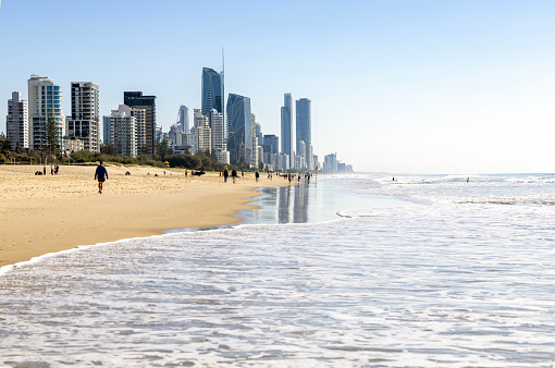 People enjoying sunny day at the beach, background with copy space, Queensland, Gold Coast Broadbeach, full frame horizontal composition