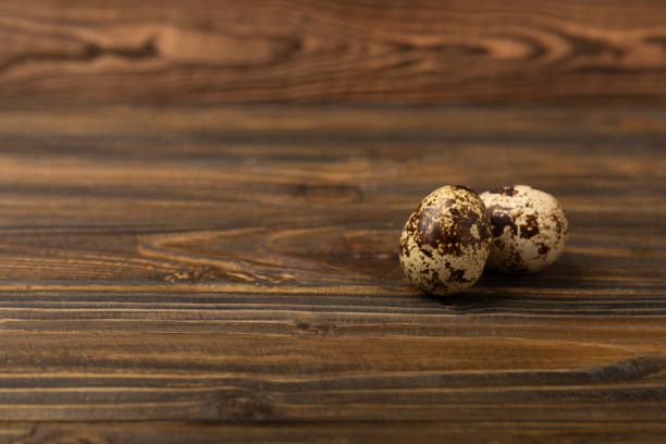 Quail eggs on a  texture background.Organic food. Place for text. Fresh quail eggs.