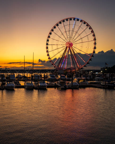 istock Ferris wheel at National Harbor at sunset 1565758512