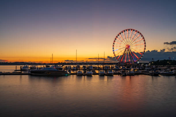 istock Ferris wheel at National Harbor at sunset 1565760528