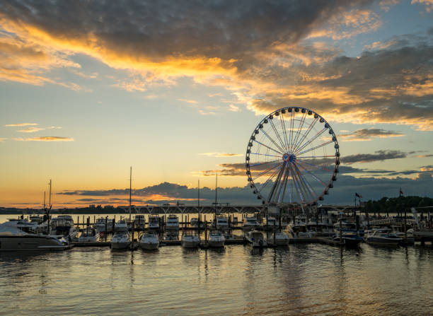 istock Ferris wheel at National Harbor at sunset 1565761078