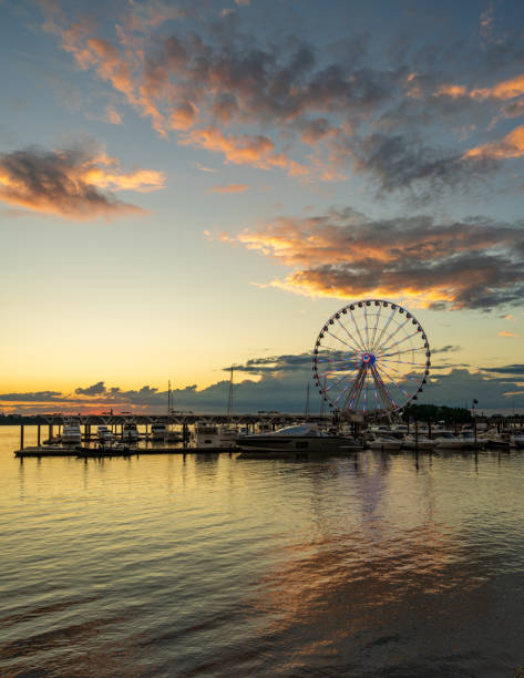 istock Ferris wheel at National Harbor at sunset 1565762102