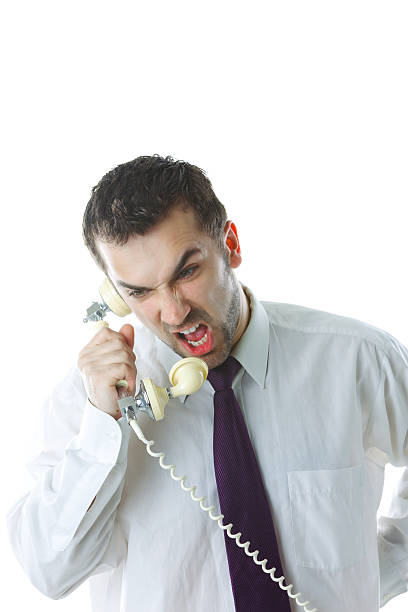 istock Angry businessman screaming in phone 156578474