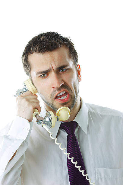 istock Angry businessman screaming in phone 156578477