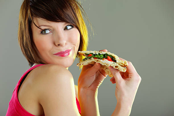 istock Young woman holding fresh sandwich 156578635