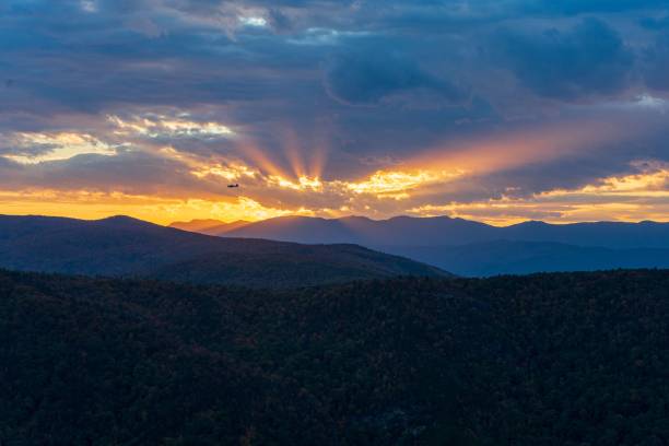 istock the sun is setting over the mountains in this time of day 1565788868