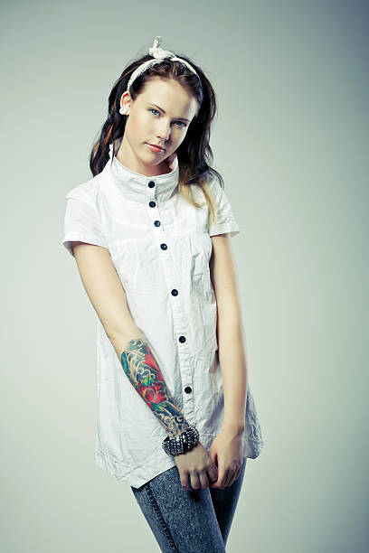 istock Beautiful young woman with tattoo 156579555