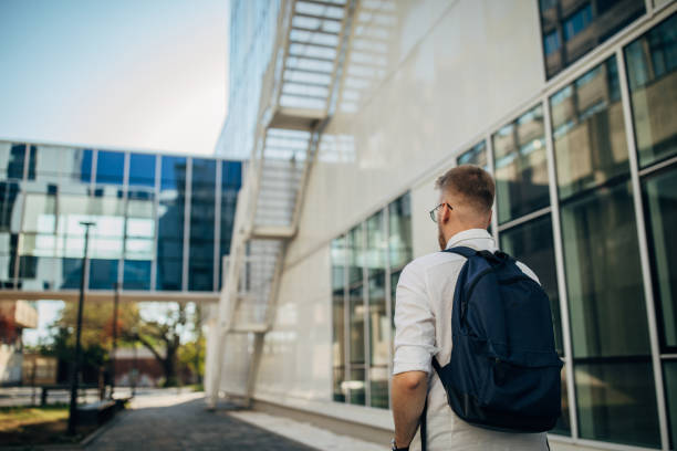 istock A young handsome businessman walking outside 1565799655