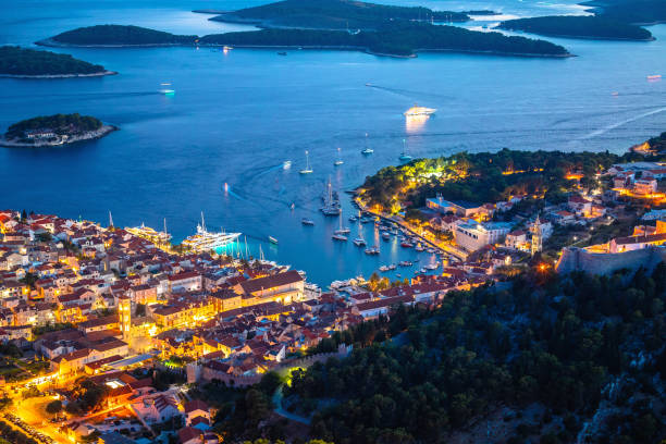 istock Aerial view of Hvar rooftops and harbor evening view 1565800771