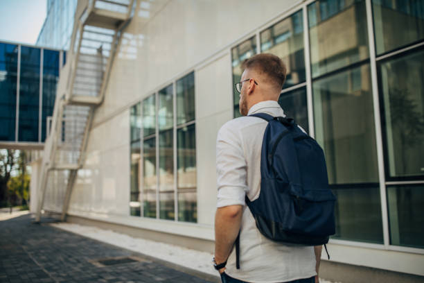 istock A young handsome businessman walking outside 1565804055