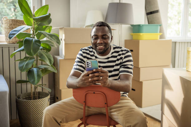 Young man moving in new house