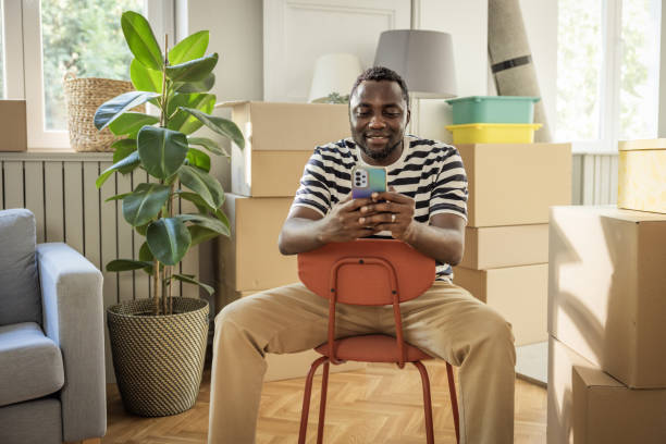 istock Young man moving in new house 1565818386
