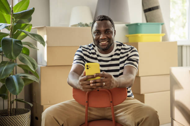 istock Young man moving in new house 1565818919