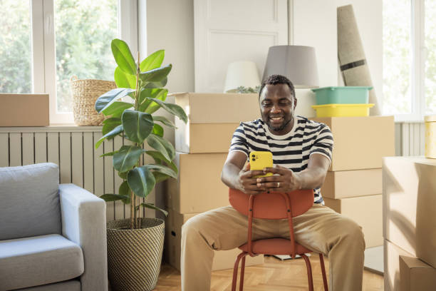 istock Young man moving in new house 1565819439