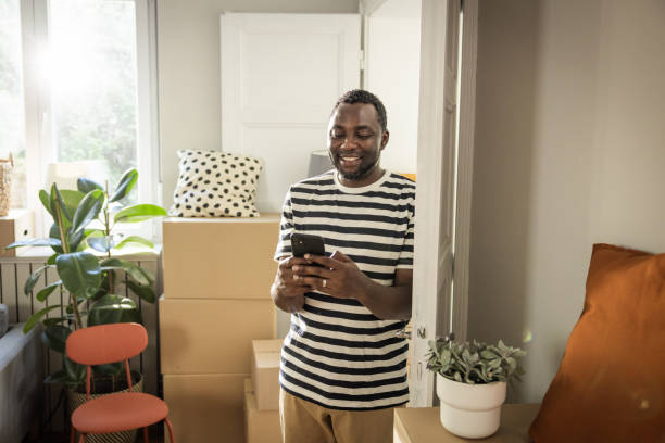 istock Young man moving in new house 1565822239