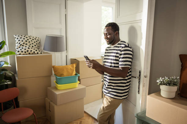 istock Young man moving in new house 1565823393