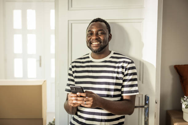 istock Young man moving in new house 1565823944