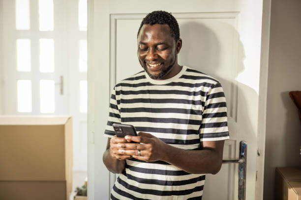 istock Young man moving in new house 1565823971
